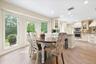 Hardwood-finish flooring, recessed lighting, white cabinetry.