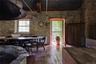 Dining area with hardwood / wood-style floors and radiator