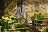 Doorway to property featuring stone siding