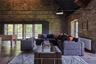 Living room featuring hardwood / wood-style flooring, radiator, high vaulted ceiling, and beamed ceiling