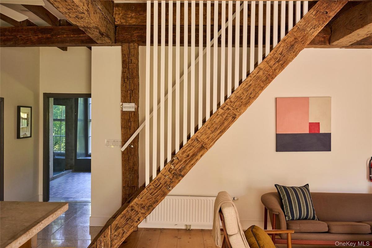 Stairway with beamed ceiling