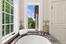 An oversized 80-gallon air therapy tub perfectly positioned to capture stunning views, creating a serene and spa-like retreat.
