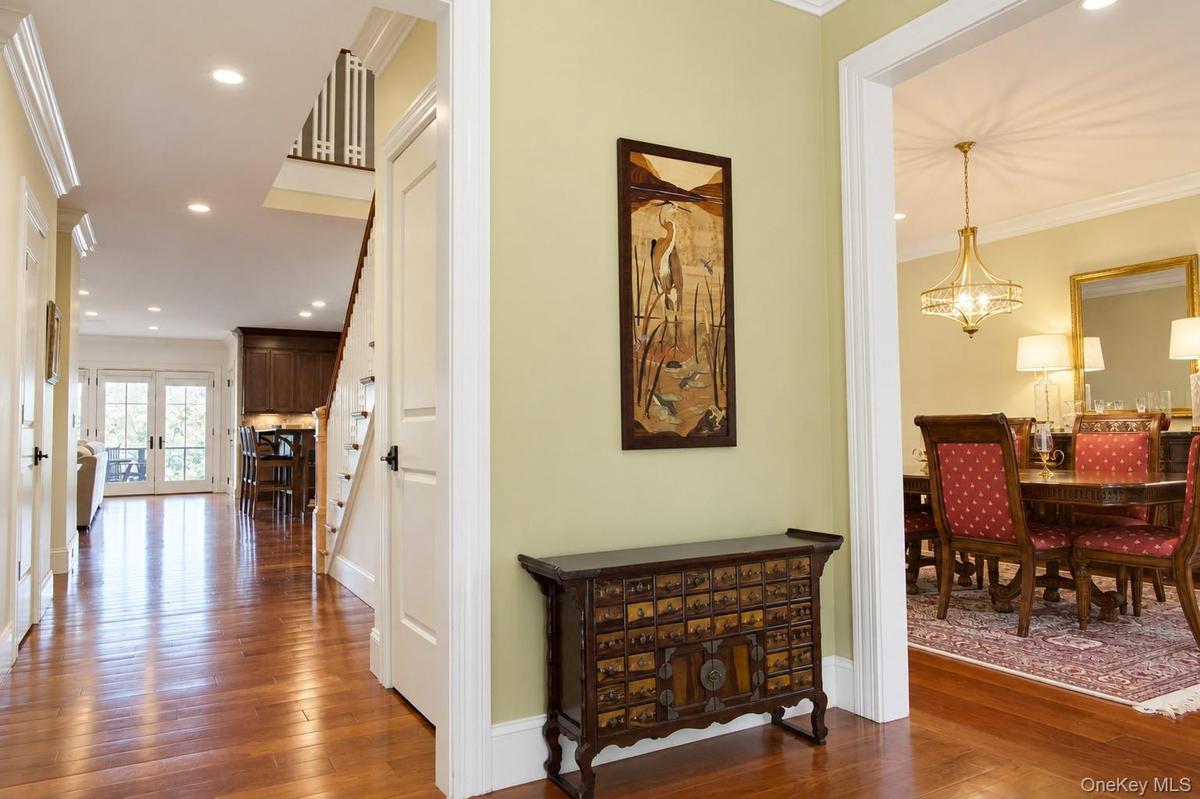 Hardwood flooring throughout, recessed lighting, crown molding and a custom staircase.