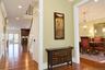 Hardwood flooring throughout, recessed lighting, crown molding and a custom staircase.