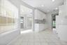 White cabinetry, Kitchen, tile flooring, recessed lighting, and a backsplash