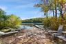 Sandy beach and sitting area on the water