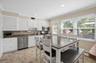 Eat-in kitchen with stainless steel appliances, breakfast bar and access to your deck.