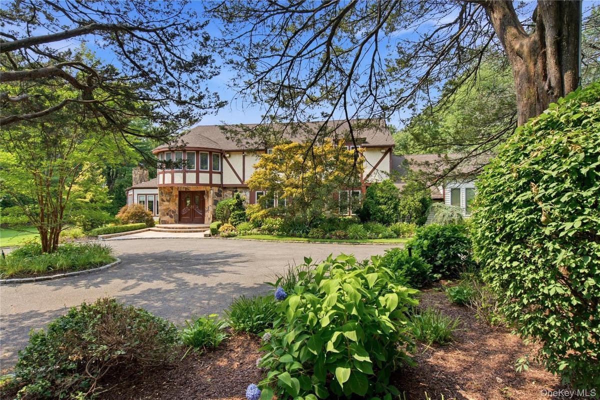 Tudor-style exterior with stone and half-timber accents.