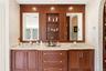 French Provincial -style vanity, with duel sinks and integrated shelving