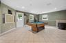 Large family room with access to your outside deck and fabulous backyard.