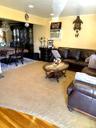 Recessed lighting, wood-finish flooring, and a formal dining area