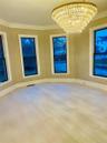 Light wood-finish flooring with crisp white trim
