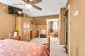 Tray ceiling with recessed lighting and a ceiling fan