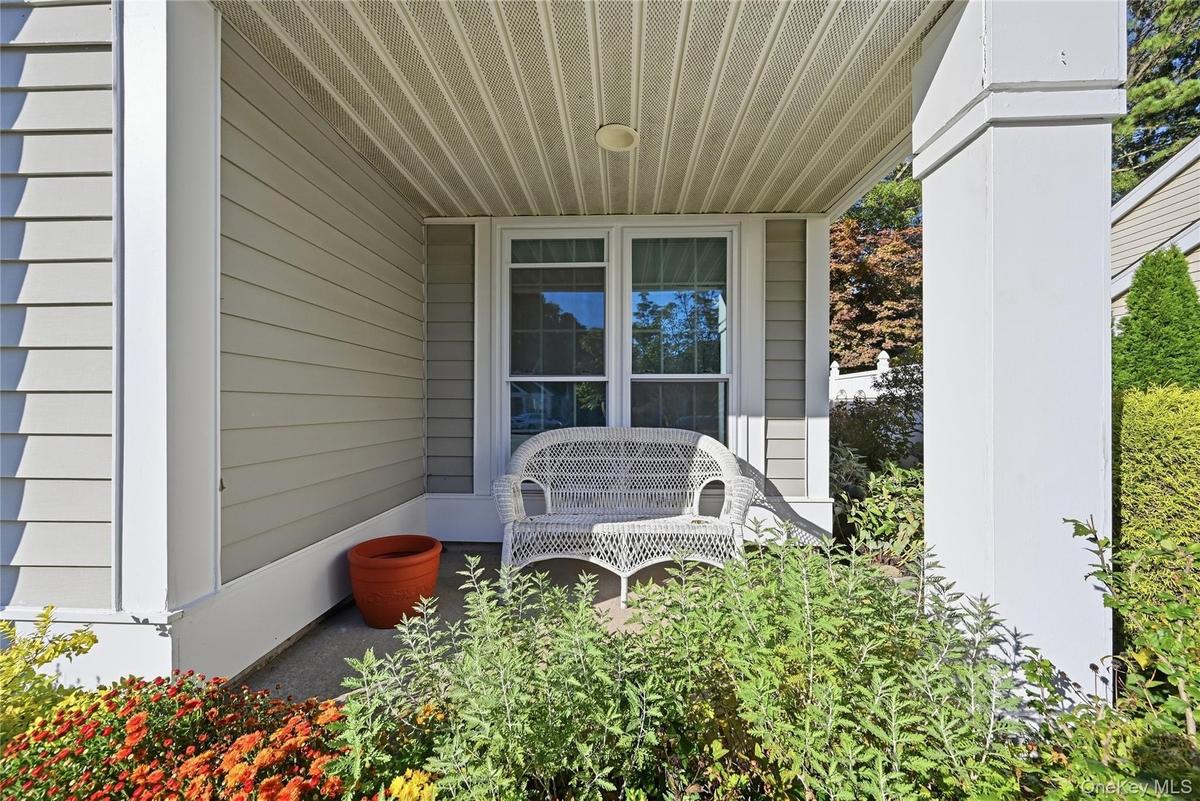 The Front Of The Condo Offers A Covered Brick/Paver Patio - A Perfect Spot To Relax & Unwind, Read The Newspaper Or Catch Up With Friends & Neighbors.