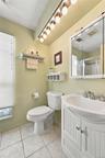The Primary Bathroom Offers An Oversized Step In Shower With  Updated Beautiful Ceramic Tile Walls/Surround, Accent Border/Trim, An Updated Vanity & C
