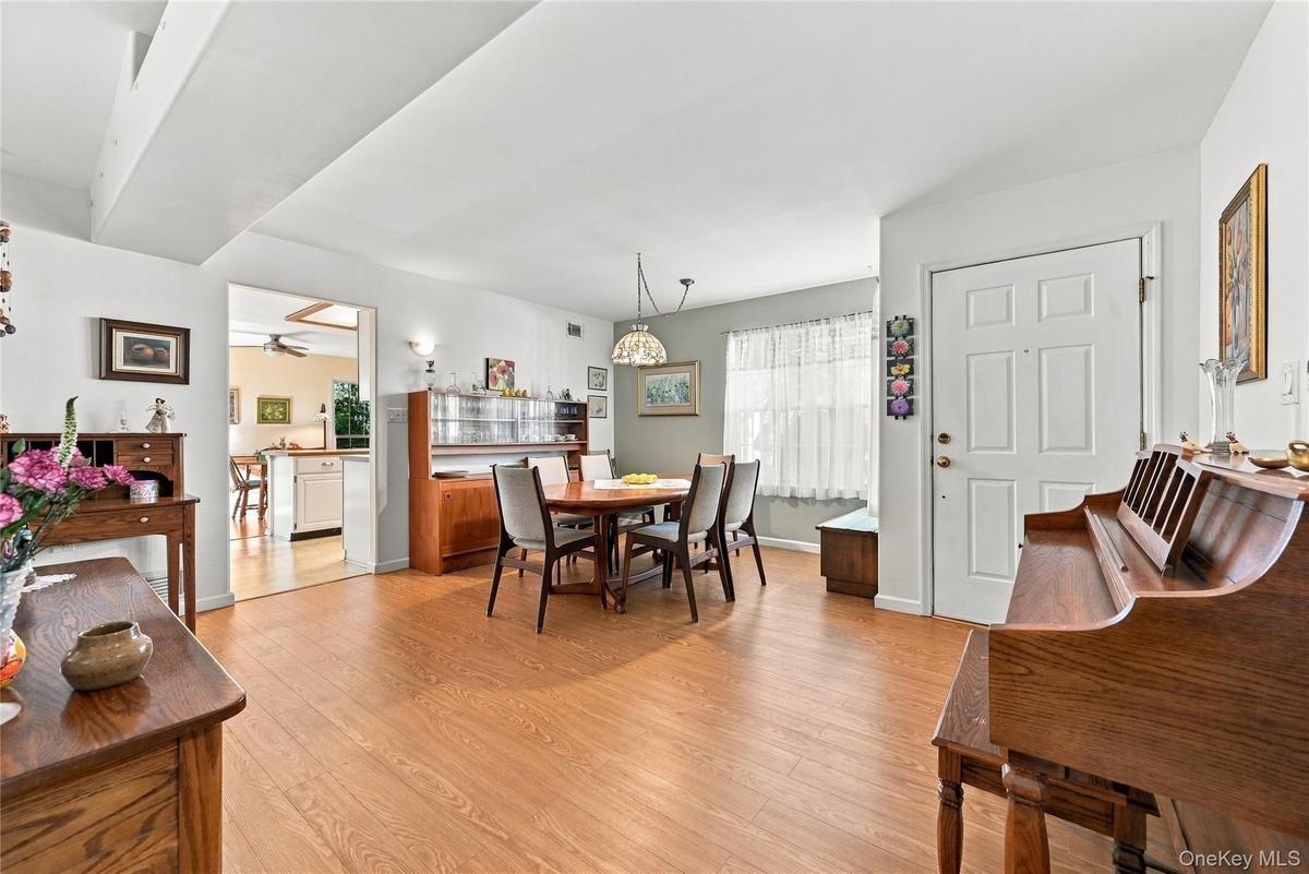 The Beautiful Open Floorplan Flows From The Formal Dining Room Into The Formal Living Room - A Perfect Large Space For Entertaining Family & Friends, 