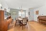 The Formal Entrance Foyer Opens Into A Beautiful Open Formal Dining Room & Formal Living Room...The Spacious Formal Dining Room Offers  Large Corner W