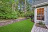 The Home Offers A Very Private Backyard With Beautiful Landscape, Accent Stone Walls & Tall Privacy/Shade Trees
