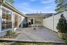 Off Of The Kitchen/Leisure Room & The Formal Living Room Is A Large Brick/Paver Patio With A Gardening Area/Space, And The Patio Overlooks The Beautif