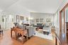 The Entrance Foyer Opens Into A Beautiful Open Living Room & Dining Room...The Elegant Formal Living Room Offers Warm & Inviting Colors With An Accent