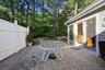 The Large Brick/Paver Patio Offers Ample Outdoor & Entertaining Space, Has PVC Privacy Fencing, And Overlooks The Beautiful Mature Landscape & Very Pr