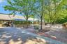 An Expansive Stunning Brick/Paver Patio Off The Back Of The Country Club Clubhouse & Beautiful Open Enjoyment Spaces.