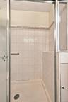 The Primary Bathroom Offers An Oversized Shower With Beautiful Updated Ceramic Tile Walls & An Accent Border/Trim.