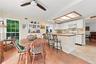 Between The Eat In Kitchen & The Leisure Room Is A Breakfast Bar & Barstool Area - Perfect For A Quick Bite And For Preparing & Serving Meals. The Lei