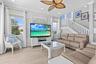Living Room with Crown Molding & Remote