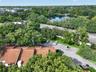 AERIAL VIEW OF TOWNHOME WITH LAKE LILY ACROSS U.S. 17-92