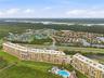 Resort amenities from the air — courts, pool, and the intracoastal beyond.
