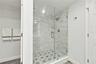 Shower and view of Water closet