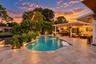 Twilight View of Saltwater Pool and Entertainment Space