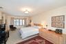 Large primary bedroom ensuite with lots of closet space, and full bathroom