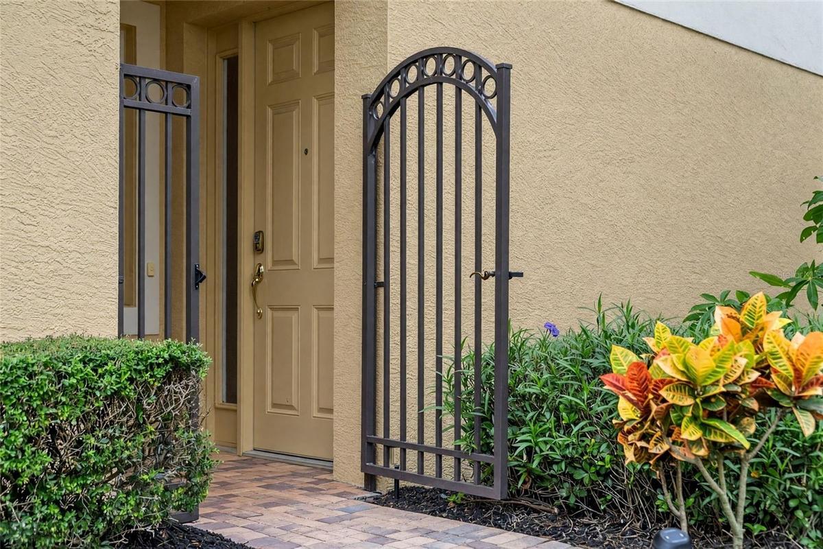A tucked-away gated entrance adds privacy and a convenient spot for deliveries.