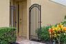 A tucked-away gated entrance adds privacy and a convenient spot for deliveries.