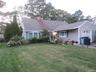 Gray shingle siding with a front-facing attached garage