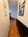 Hall featuring a textured ceiling