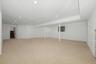 Finished lower level with ample space for recreation and relaxation.