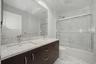 Skylight bathroom shared by two bedrooms.