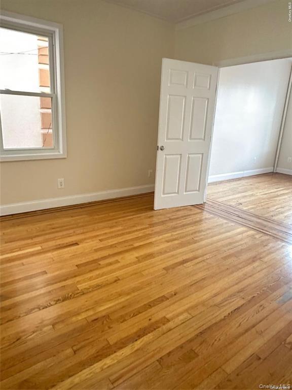 Hardwood flooring throughout, neutral wall tones, and white trim