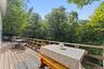 Expansive wood deck with a perimeter railing.
