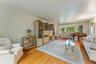 Hardwood flooring with expansive windows.