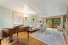 Hardwood flooring throughout with glass sliding doors to deck.