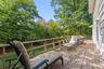 Expansive wood deck with a perimeter railing.