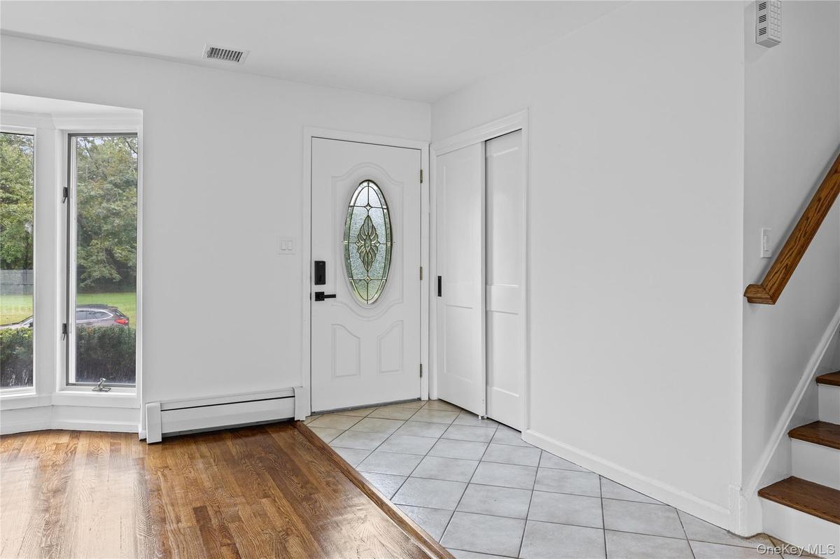 Welcome Home!! Foyer opens to an inviting living room.