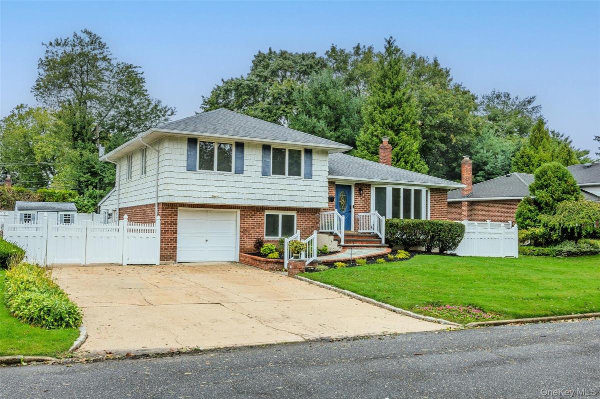 One Car Garage and expanded driveway w/ample parking.