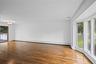 Light and Bright large Bow Window. Beautiful Hardwood Flooring