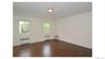 Dark wood-finish flooring with white trim