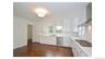 Kitchen featuring white shaker cabinetry, stainless steel appliances, recessed lighting, and wood-finish flooring